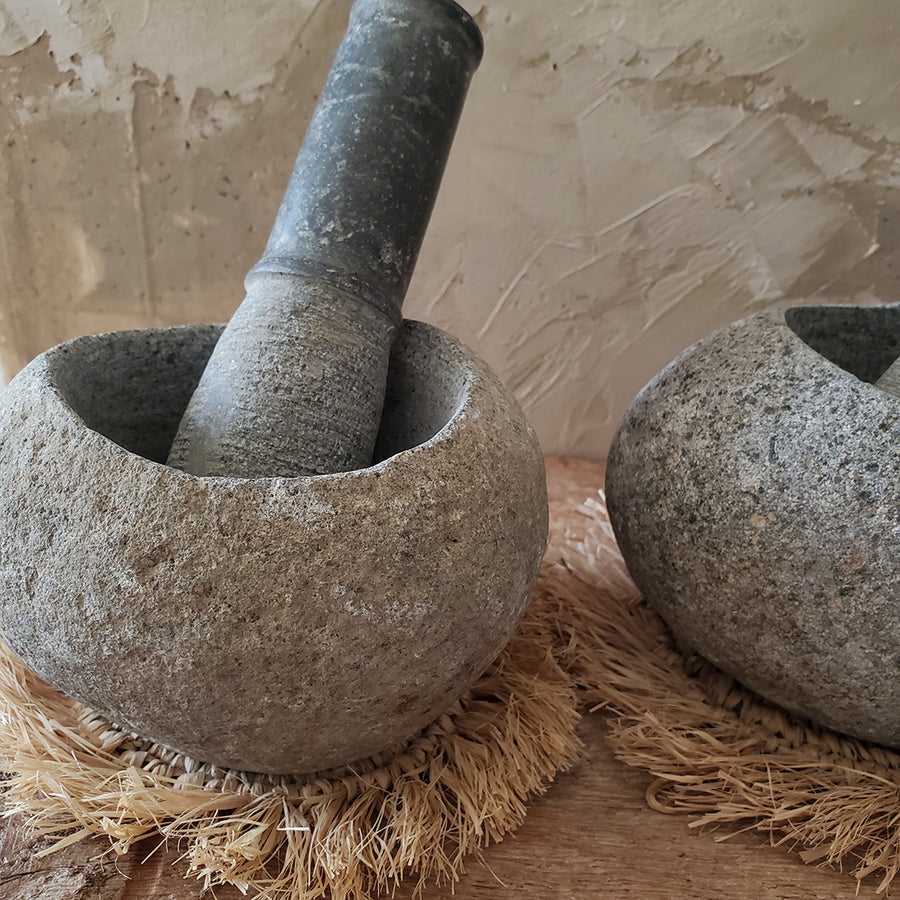 Natural river stone mortar and pestle with raffia mat