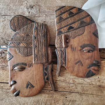 2 hand carved wood masks